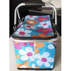 Panier pique‑nique isotherme pliable vert à fleurs avec cadre aluminium et fermeture éclair.