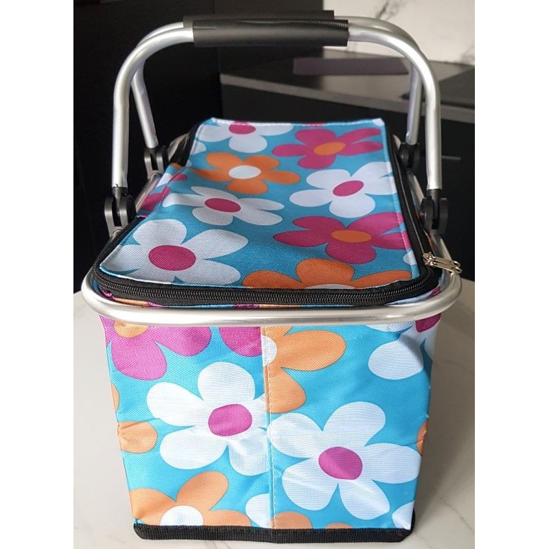 Panier pique‑nique isotherme pliable vert à fleurs avec cadre aluminium et fermeture éclair.