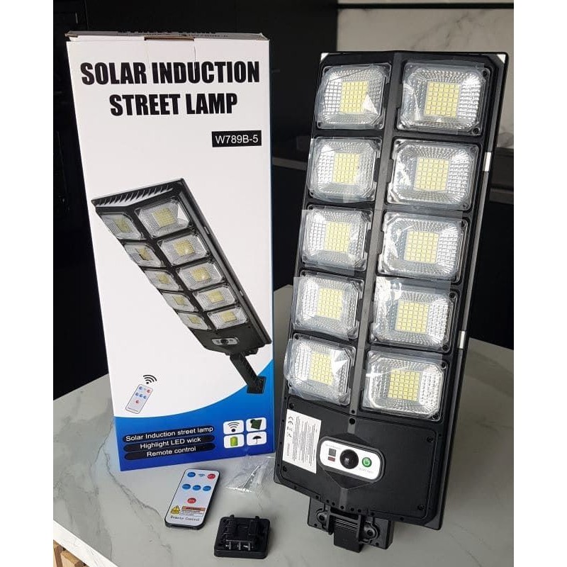 Lampadaire solaire LED avec détecteur de mouvement, télécommande et 3 modes – longueur 57 cm.