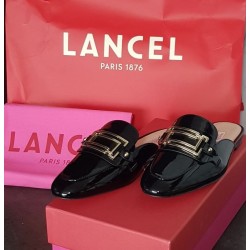 Mules Lancel Signature noires vernis – Taille 37 – Occasion