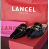 Mules Lancel Signature noires vernis – Taille 37 – Occasion